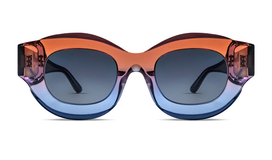 Designer round sunglasses in translucent gradient orange-blue acetate