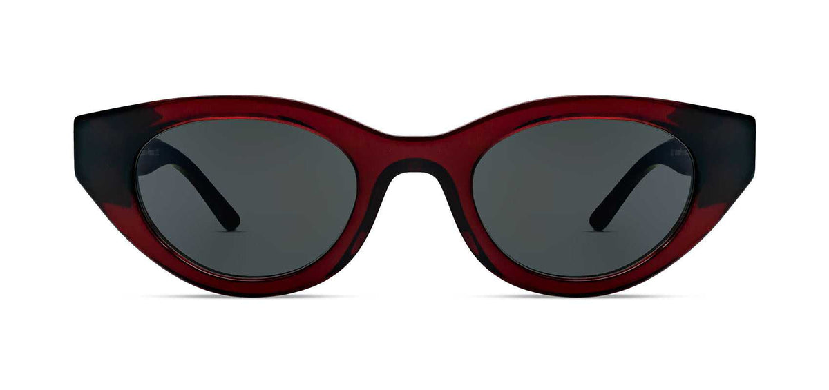 Cat-eye sunglasses with red acetate frame and dark tinted lenses