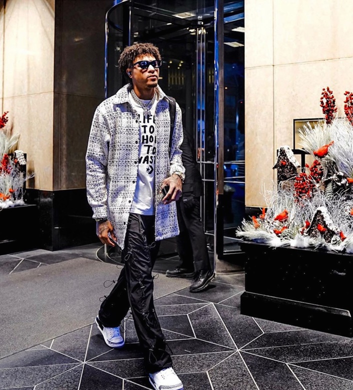 Kelly Oubre Jr. from the Phoenix Suns wearing the RHUDE x THIERRY LASRY “RHODEO”